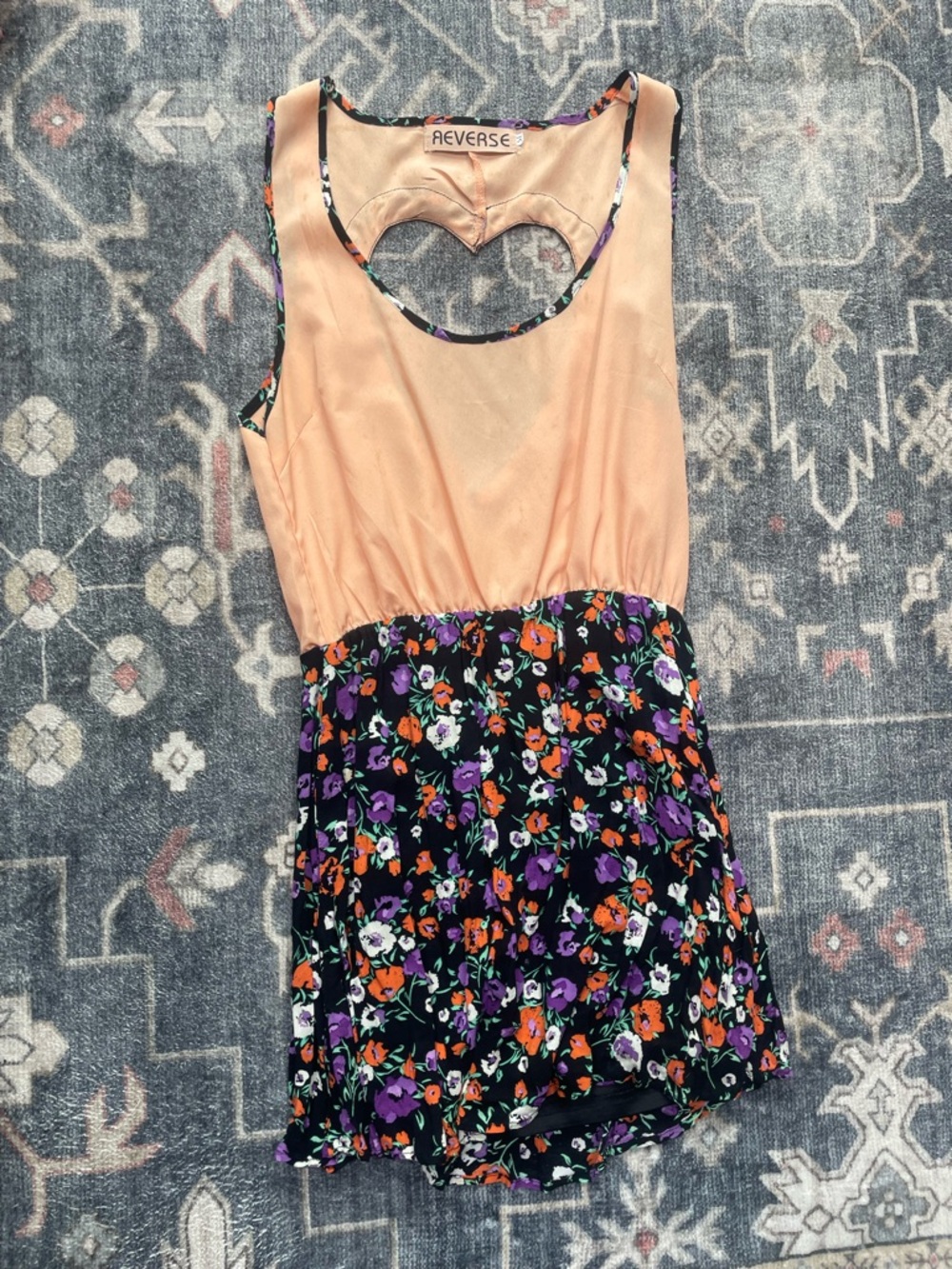 Reverse Peach Lined Garment with Black Floral Trim